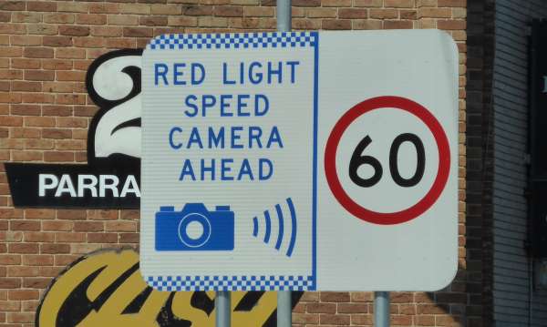 red light speed camera sign