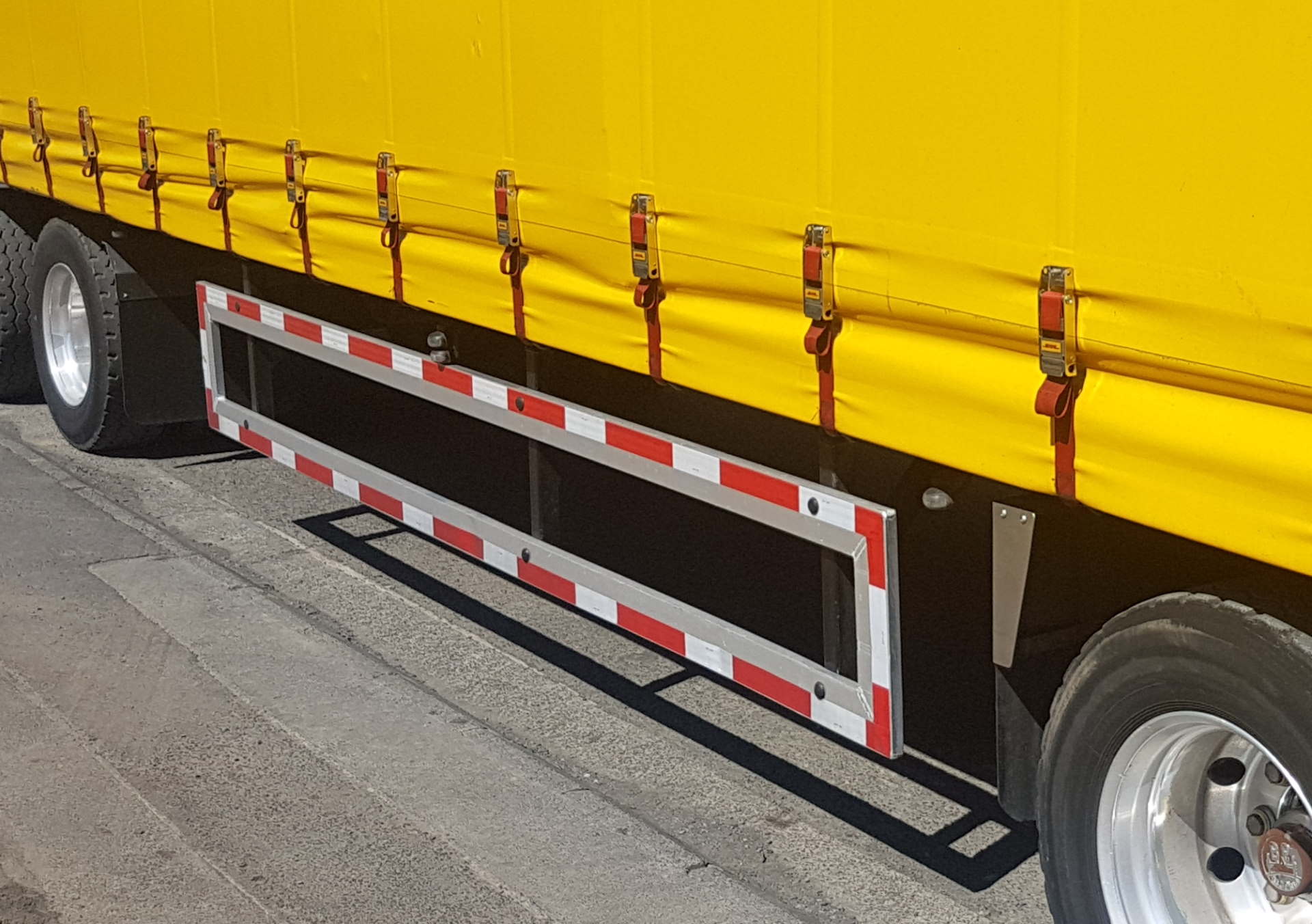 What does side underrun protection do on trucks and trailers?