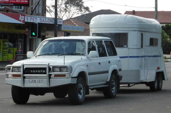 SUV towing horse float