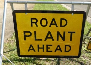 road plant ahead sign