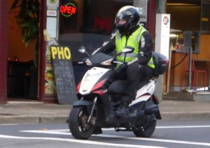 Scooter waiting at lights