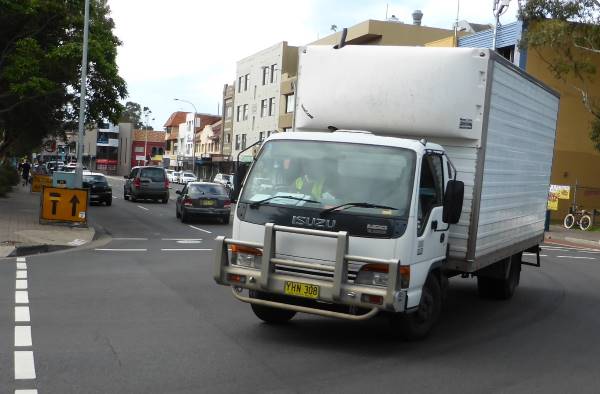 truck turning right at a crossroads