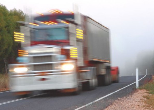 truck on rural road at speed