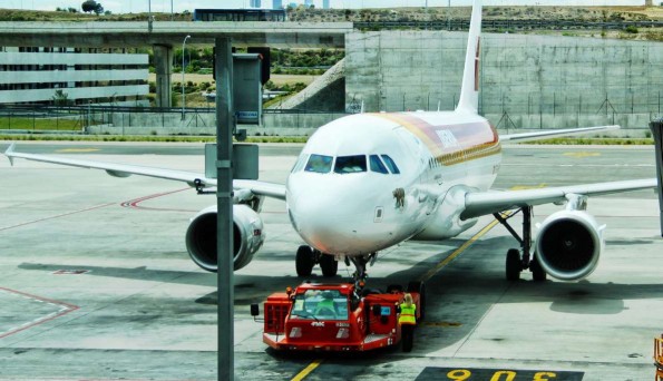 Airport tug ready to push a plane out