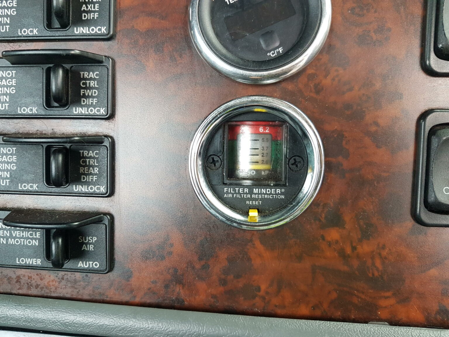 What should you check inside your truck's cab in a pre-start inspection?